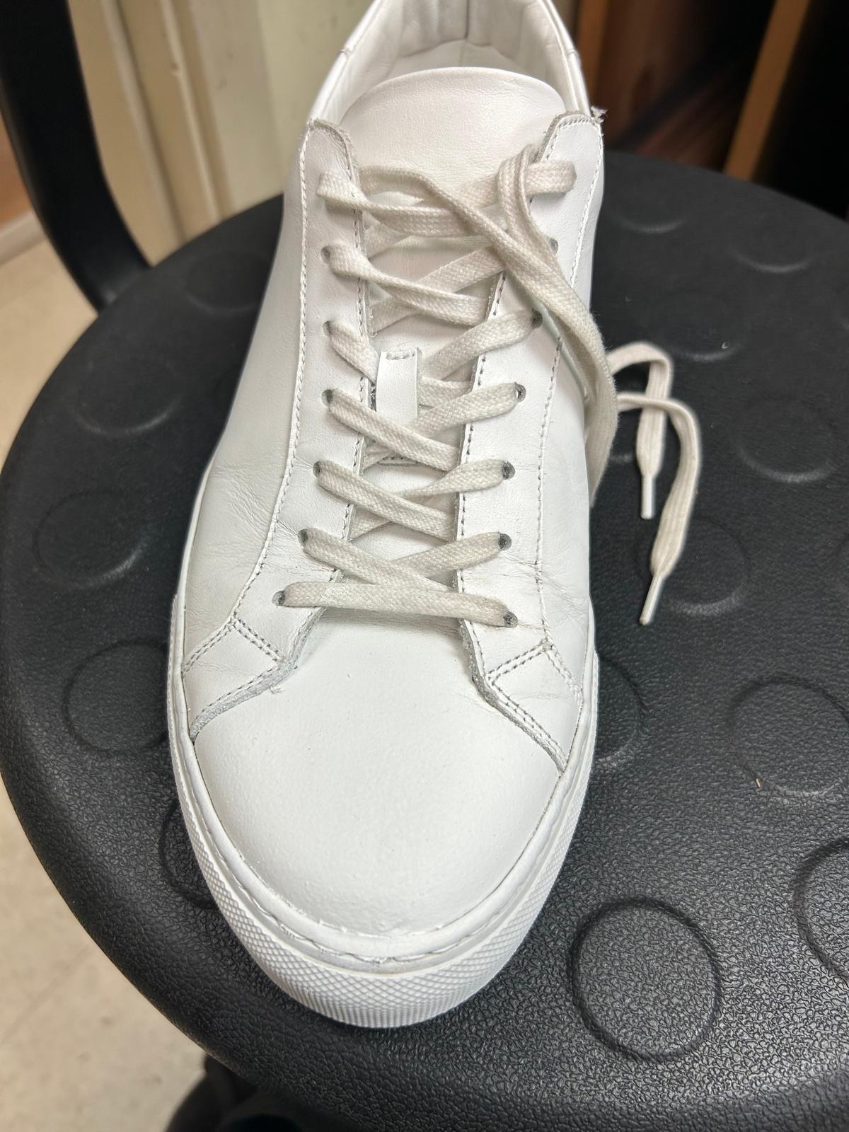 White sneaker cleaned after